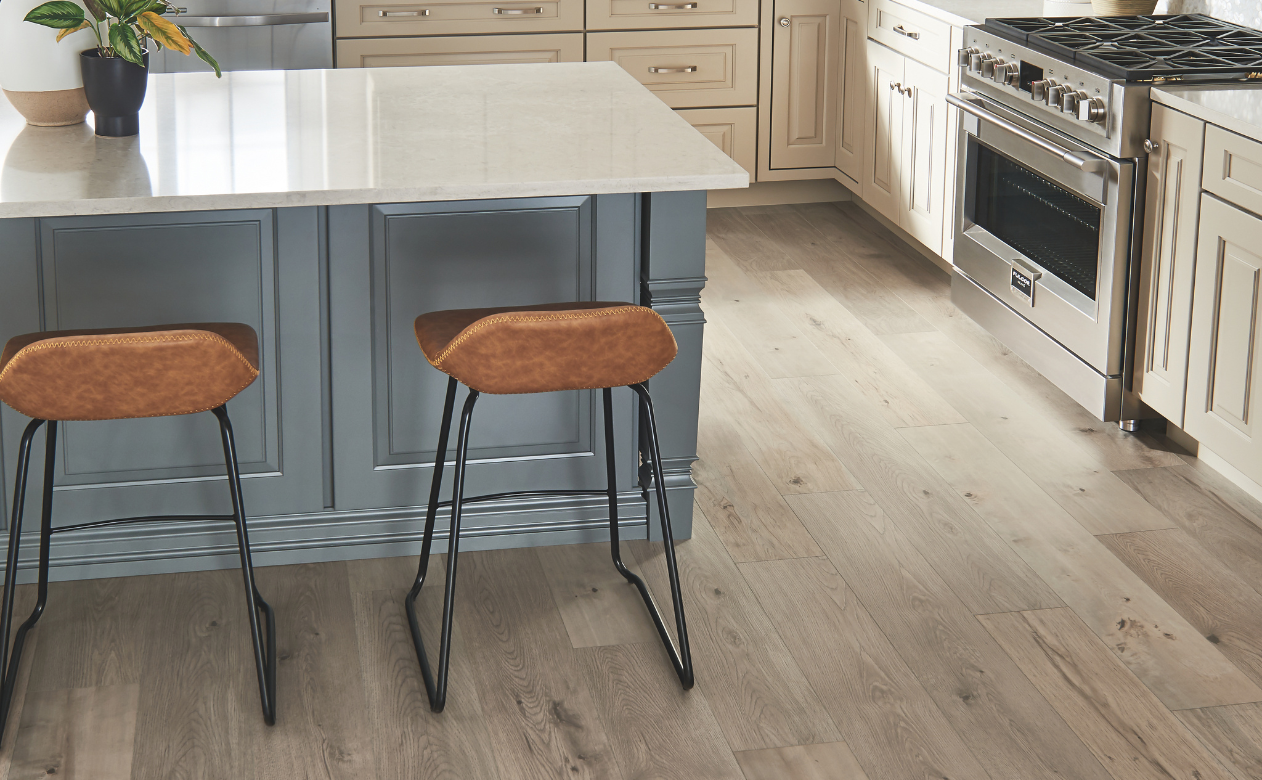 Laminate flooring in Forrest City kitchen with leather barstools