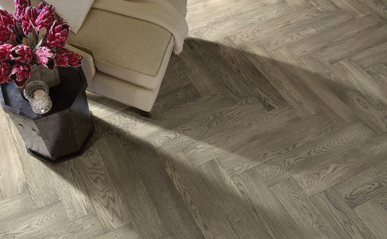 herringbone grey toned hardwood flooring in living room